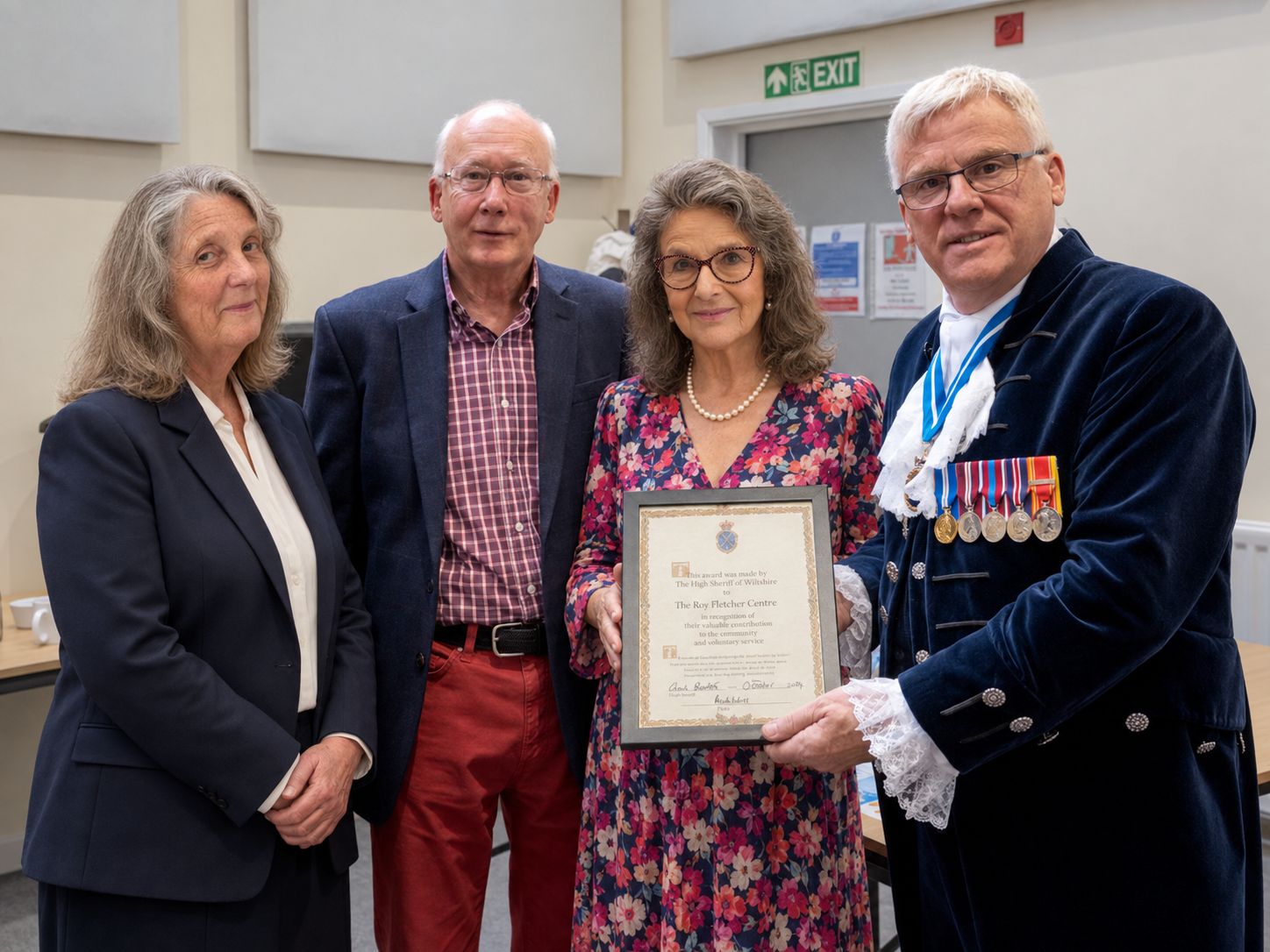 Volunteers with the High Sheriff, holding the award certificate